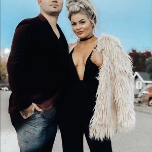 Cream faux fur coat.